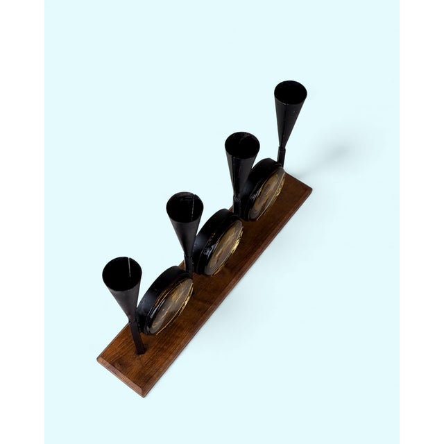 Bo Svensk candlestick, designed by Erik Höglund, 1960s. A distinctive design combining teak wood with black metal,...