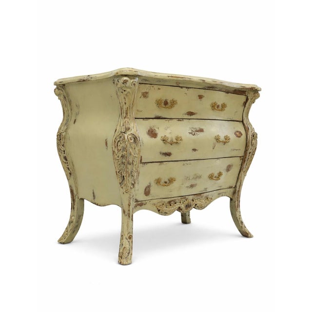A refined French Provincial bombe chest featuring a beautifully distressed green patina. This vintage Louis XV–style...