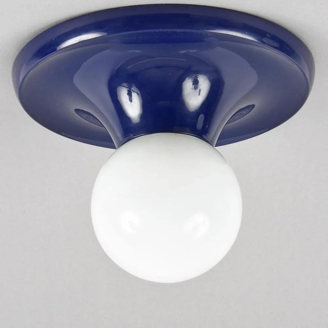 Amazing mid-century "light ball' sconce blue metal and opaline glass for flos. This fantastic item was designed by achille...