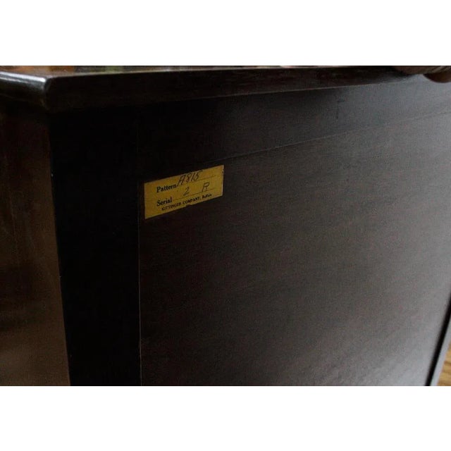 The Kittinger Mahogany 5-Drawer Tall Chest is a traditional style furniture piece with a solid brown finish. It features 5...