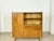Spacious vintage highboard from the 1960s. This piece of furniture impresses with its clean mid-century design, beautiful...