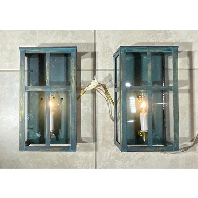 Transform your space with timeless elegance through this matching pair of handcrafted wall-hanging lanterns. Featuring a...