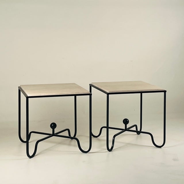 Pair of tall blackened iron and unfilled travertine 'Entretoise' side or end tables by Design Frères. Also great as a pair...