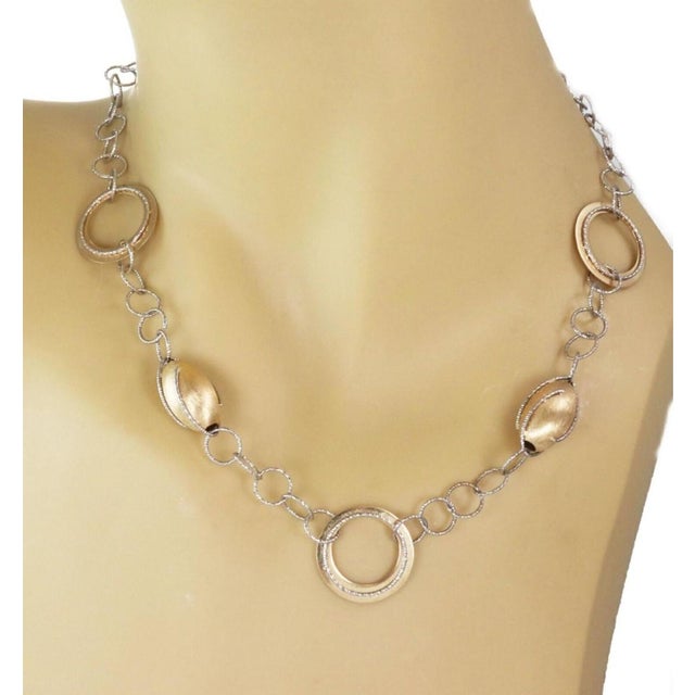 The Oval Bead & Open Ring Fancy 14k Two Tone Gold Necklace is a stunning piece of vintage and antique jewelry. This...