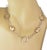 The Oval Bead & Open Ring Fancy 14k Two Tone Gold Necklace is a stunning piece of vintage and antique jewelry. This...
