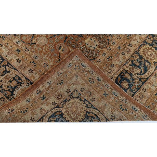This elegant Tabriz-inspired hand-knotted wool rug draws upon the rich decorative tradition of Persian carpet weaving...