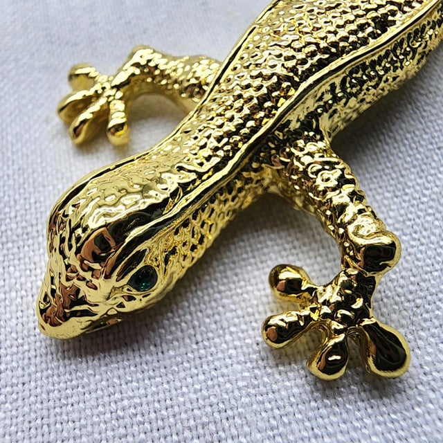 This handsome brass gecko with his gleaming figure and sparkling green eyes will make a lovely and utilitarian accent on...