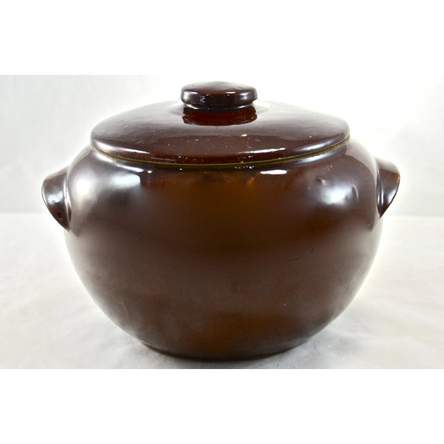Vintage lidded farmhouse bean crock or casserole with a warm brown glaze over all. Perfect decor addition in a farmhouse...