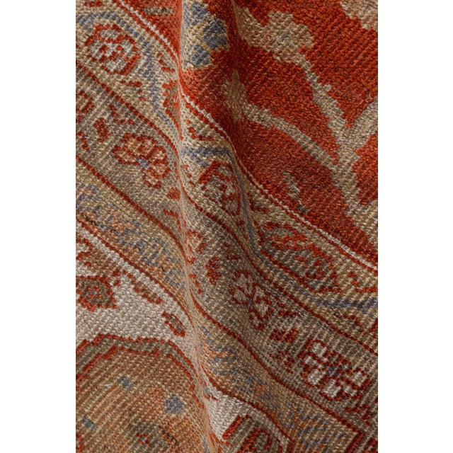 A fine example from our collection of late 19th century Persian Sultanabad carpets, the sand field with a palmette and...