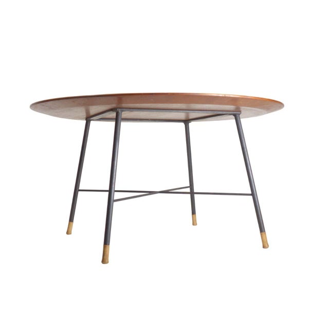 Stylish 1950s mid-century modern coffee table, characterized by clean lines and elegant simplicity. Top: The tabletop is...