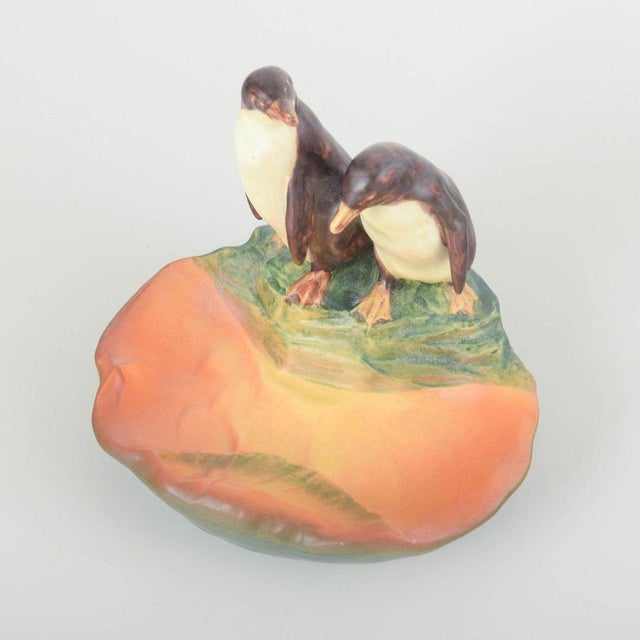 Ipsens Enke Art pottery bowl with penguins, model 228. Decorative bowl featuring two penguins standing on the rim. Glazed...
