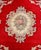 Chinese Floral Motif Rug, with central rose flower medallion on a red ground. 6' 9" L x 4' W. Provenance: From a West End...