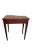 A Hepplewhite Style Mahogany Side Table that is burnt umber. This table has a curved top and one drawer and is from the...