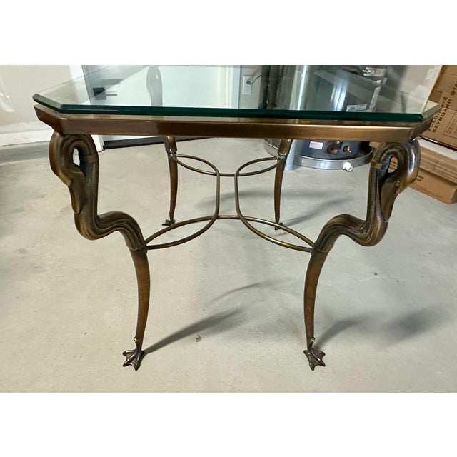 Versatile heavy solid antiqued brass table with thick ogee edge heavy glass top can add a sparkle to any room. This table...