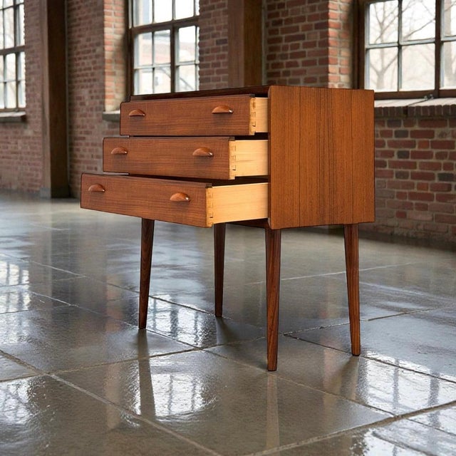 Petite danish teak chest of drawers attributed to arne vodder, denmark, c. 1960s. the cabinet is executed in teak and...