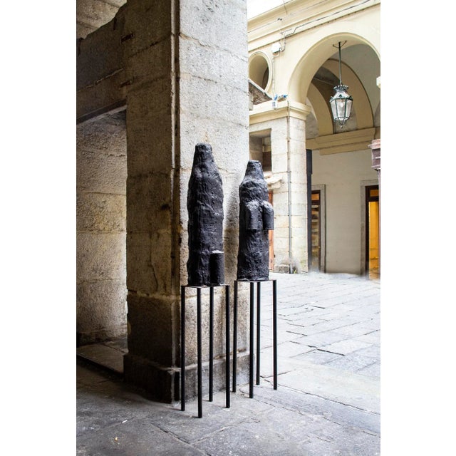 Pair of concrete and tar sculptures, iron pedestal. Work Atomic Shadows Author Sergio Ragalzi Year 1985 30x30x195 cm cm...