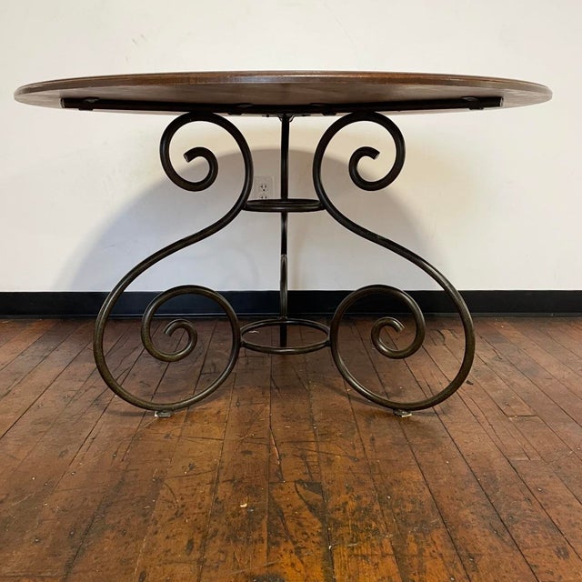 Attractive high-quality round cherry wood top dining table supported by an elegant scrolled pedestal base manufactured by...