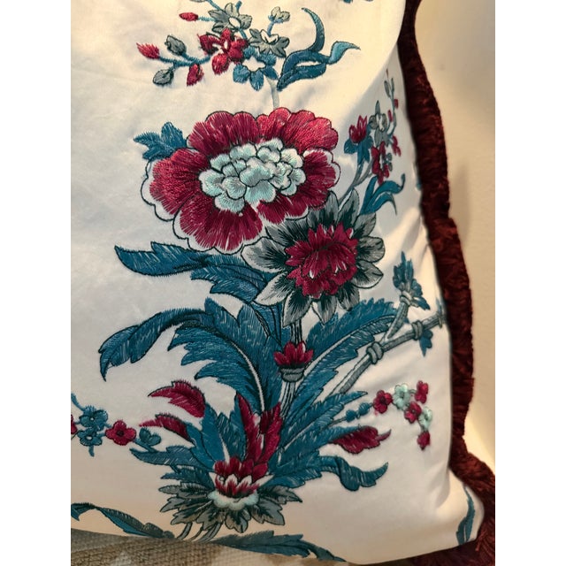 Pair of Gaston y Daniela Embroidered 24” pillows with burgundy brush trim. Down filled. This fabric retails for $400/yard.