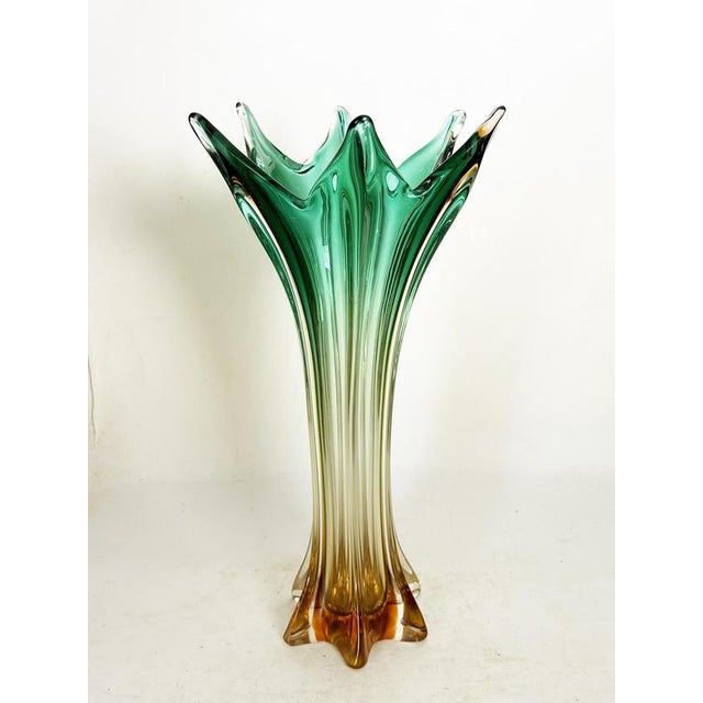 Large Italian vase in green and clear blown glass, Italy, 1950s. A spectacular decorative vase in artistic glass with...