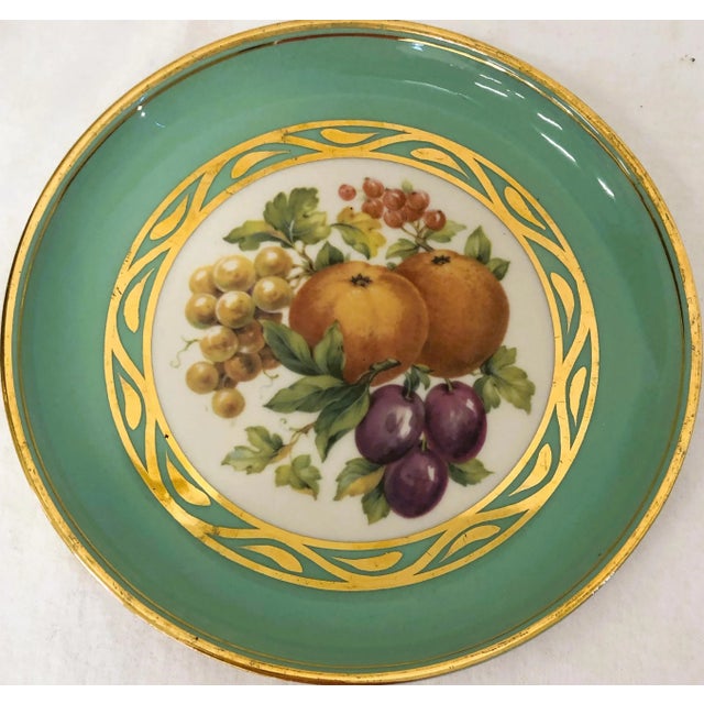 Three Vintage Hyalyn Collector's Plates in Tangerine, mint green and pale yellow. Center design of each plate has fruit...