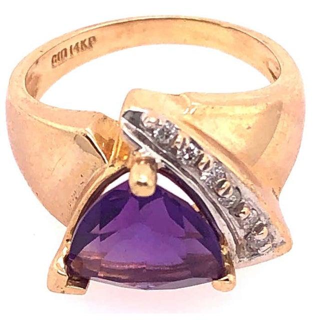 14 Karat Yellow Gold Fashion Ring with Amethyst and Round Diamond 0.10 TDW. Size 5 5 grams total weight.