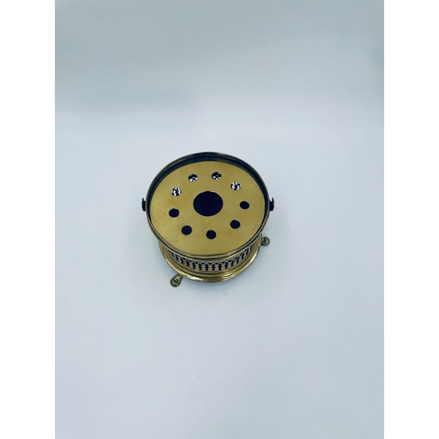 This antique jug warmer, manufactured in Germany in the 1950s, is crafted from high-quality solid brass. The structure...