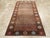 This mid-20th century Turkish Anatolian gallery carpet, measuring 5' 11" x 10' 10", features a strikingly minimalist field...