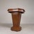Everything about this table is octagonal: the top, the pedestal, and the base. The pedestal features geometric wood...
