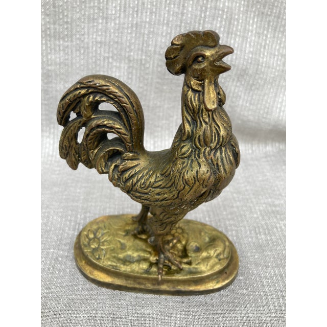 Small, heavy vintage solid brass rooster figurine. No markers mark. Excellent condition. Rooster measures 3 3/4" by 2" by...
