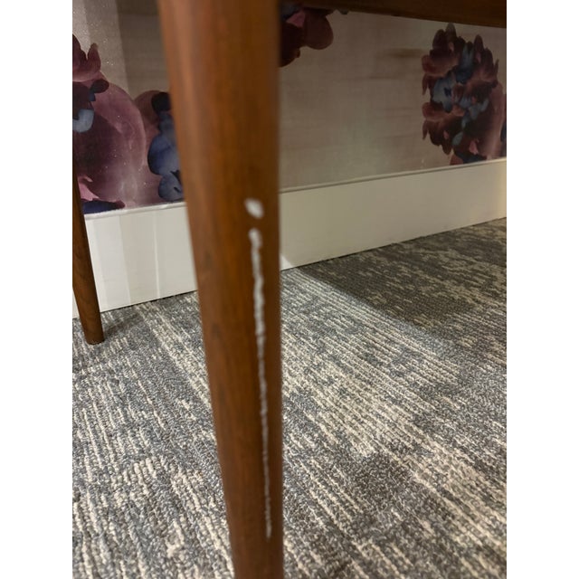 Gorgeous lines. Historical piece. True MCM. Heirloom furniture. Walnut with gorgeous grain and finish. Drop leaf on the...