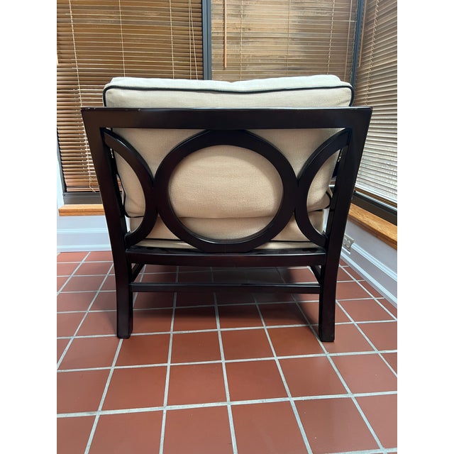 Available is a single lounge chair designed by Laura Kirar for Baker Furniture. The chair features an architectural dark...