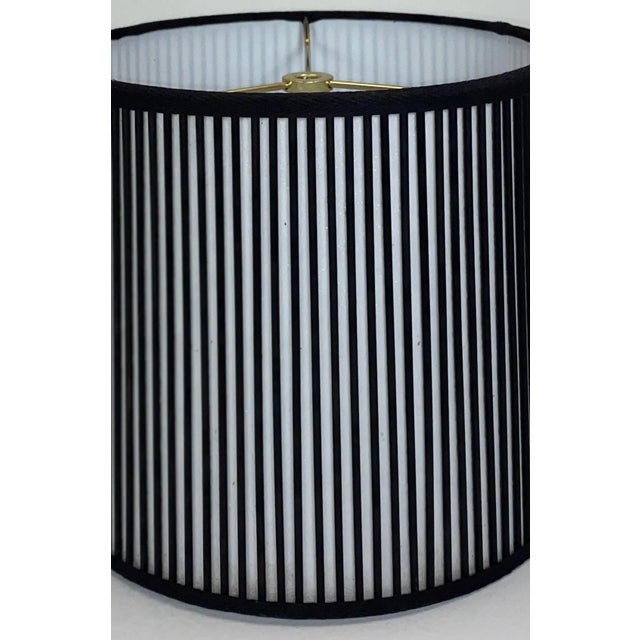 Solid black sticks are added by hand, one at a time, over artisanal, vellum paper. This Stick Shade will add charm to any...