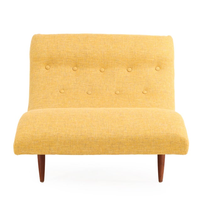 This iconic form chaise boasts a roomy, récamier-style curve designed for two, supported by tapered wood legs. Unmarked,...