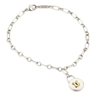 Tiffany & Co. Padlock Charm Bracelet in Sterling Silver & 18k Yellow Gold For Sale