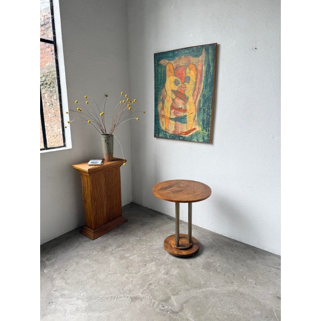 Vintage small side table, 1930s Art Deco style. Walnut veneer with three chromed metal tubes. This circular side table has...