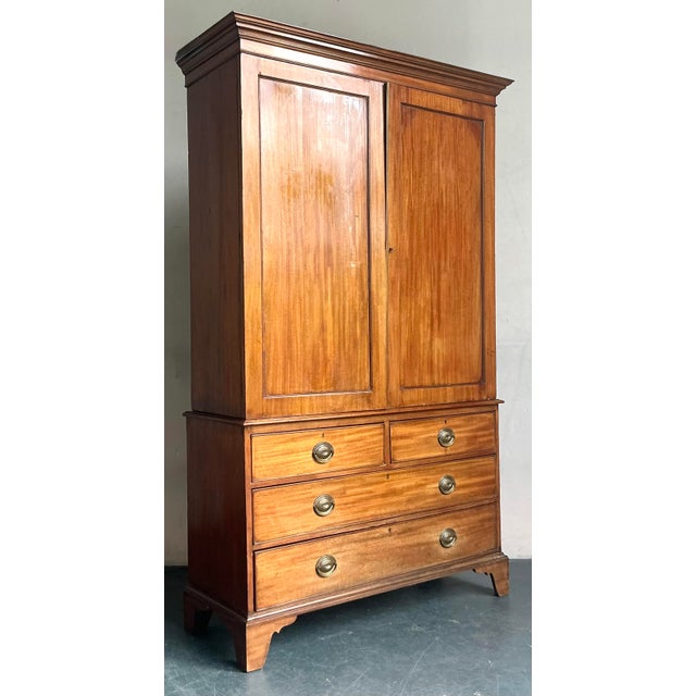 Elevate your interior with this exceptional Vintage Regency Federal Mahogany Linen Press, a true testament to early 19th-...