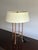 Elegant pair of designer table lamps by Baker Furniture for the Milling Road collection, featuring a refined open cage...