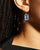 This brilliant blue topaz earrings are one of our favorites. The emerald cut stone gives the piece an even cleaner look....