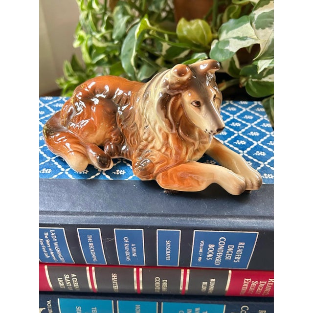 Must love dogs… any dog or collie collector will appreciate this porcelain collie by Lefton. The reclining figure is...