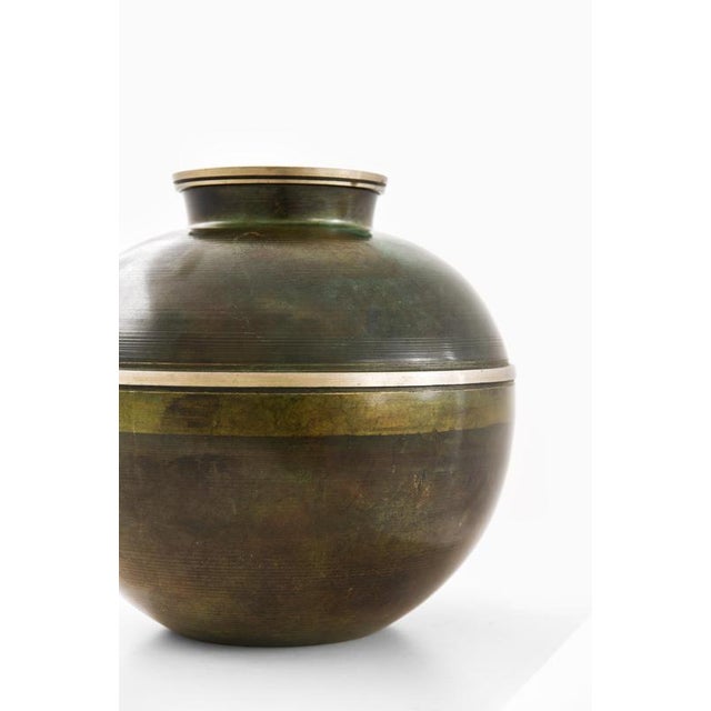 This Art Deco vase, produced by Birka Metall in Sweden during the 1930s, exemplifies the refined decorative sensibilities...
