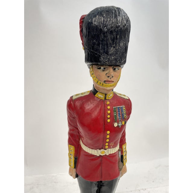 Particular Liquor Bottle shaped in the shape of an English Royal Guard, made of ceramic, with removable hat.