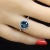 This is part of Chairish’s Fine Jewelry assortment. Stunning Blue Topaz and Diamond Halo Ring in 14K White Gold Elevate...
