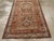 This early 20th-century Persian Afshar rug presents a bold tribal composition centered on three vertically aligned...
