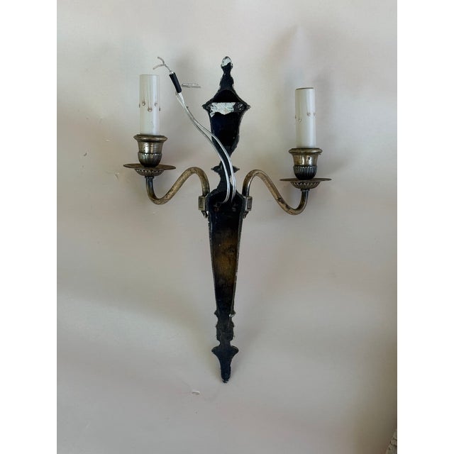 Silver plated cast metal candelabras. Details: Cast metal, silver plated electric wall sconces. These take standard...