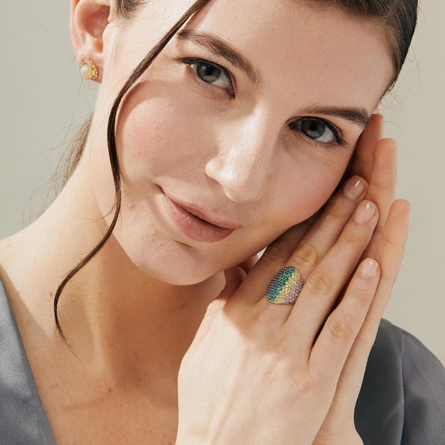 Created in 18 karat yellow gold Emeralds 0.45 carat approx. Multicolor sapphires 2.75 carats approx. Ring size US 7, can...