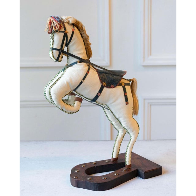 Charming and sculptural, this French decorative horse from the 20th century captures the elegance and vitality of...