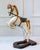 Charming and sculptural, this French decorative horse from the 20th century captures the elegance and vitality of...