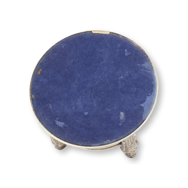 A festive vintage Godinger silverplate wine coaster encircled by four standing nutcrackers, each finely detailed in full...