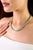 This tennis necklace features a seamless row of natural emeralds that radiate timeless sophistication. Set with 63...