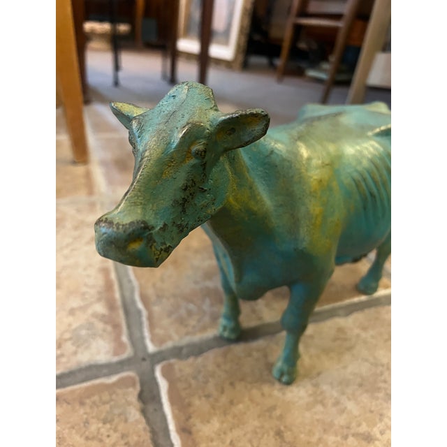 This is a fabulous example of an early 1900s cast iron cow display commonly displayed in butcher shops, creamery or...